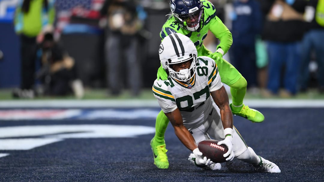 Green Bay Packers receiver Romeo Doubs catches a pass for a touchdown against Seattle Seahawks cornerback Devon Witherspoon.