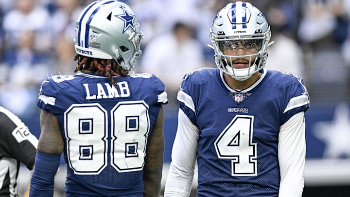 Dallas Cowboys quarterback Dak Prescott and wide receiver CeeDee Lamb walk on the field during a game. Dallas Cowboys quarterback Dak Prescott and wide receiver CeeDee Lamb walk on the field during a game.