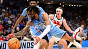 Mar 21, 2025; Milwaukee, WI, USA; North Carolina Tar Heels guard RJ Davis (4) chases a loose ball during the second half of a first round NCAA men’s tournament game against the Mississippi Rebels at Fiserv Forum. Mandatory Credit: Benny Sieu-Imagn Images