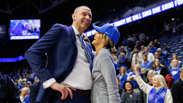 Nov 29, 2024; Lexington, Kentucky, USA; Kentucky Wildcats head coach Mark Pope talks with his wife Lee Anne after the game against the Georgia State Panthers at Rupp Arena at Central Bank Center. Mandatory Credit: Jordan Prather-Imagn Images