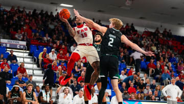 Nov 14, 2023; Boca Raton, Florida, USA; Florida Atlantic Owls guard Alijah Martin (15) shoots over Eastern Michigan Eagles forward Connor Serven (2) during the first half at Eleanor R. Baldwin Arena. Mandatory Credit: Rich Storry-USA TODAY Sports