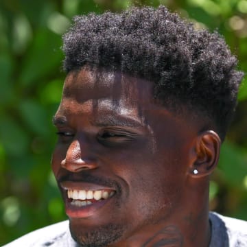 Jun 4, 2024; Miami Gardens, FL, USA; Miami Dolphins wide receiver Tyreek Hill (10) speaks to reporters during mandatory minicamp at Baptist Health Training Complex.