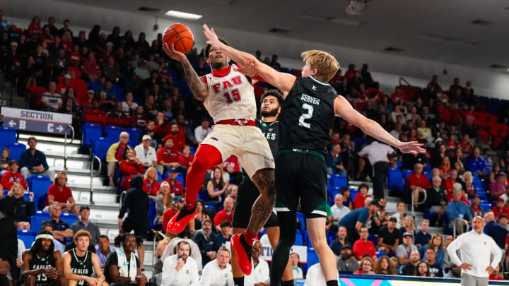 Nov 14, 2023; Boca Raton, Florida, USA; Florida Atlantic Owls guard Alijah Martin (15) shoots over Eastern Michigan Eagles forward Connor Serven (2) during the first half at Eleanor R. Baldwin Arena. Mandatory Credit: Rich Storry-USA TODAY Sports