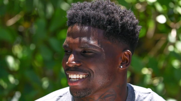 Miami Dolphins wide receiver Tyreek Hill speaks to reporters during mandatory minicamp at Baptist Health Training Complex.