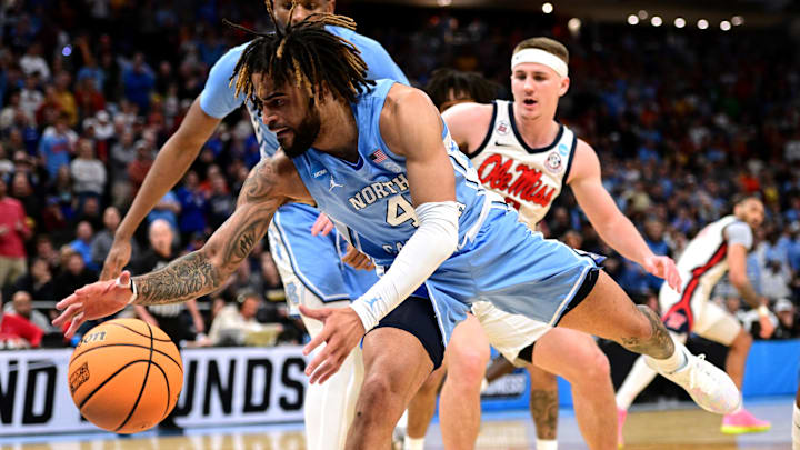 Mar 21, 2025; Milwaukee, WI, USA; North Carolina Tar Heels guard RJ Davis (4) chases a loose ball during the second half of a first round NCAA men’s tournament game against the Mississippi Rebels at Fiserv Forum. Mandatory Credit: Benny Sieu-Imagn Images