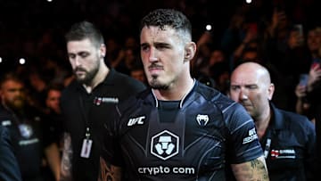 Jul 22, 2023; London, UNITED KINGDOM; Tom Aspinall (red gloves) enters the arena before the fight against Marcin Tybura (blue gloves) during UFC Fight Night at O2 Arena. Mandatory Credit: Per Haljestam-Imagn Images