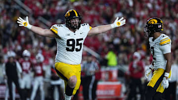 Oct 11, 2025; Madison, Wisconsin, USA; Iowa Hawkeyes defensive lineman Aaron Graves (95) celebrates a defensive stop against the Wisconsin Badgers at Camp Randall Stadium. Mandatory Credit: Ross Harried-Imagn Images