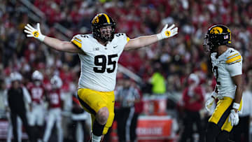 Oct 11, 2025; Madison, Wisconsin, USA; Iowa Hawkeyes defensive lineman Aaron Graves (95) celebrates a defensive stop against the Wisconsin Badgers at Camp Randall Stadium. Mandatory Credit: Ross Harried-Imagn Images