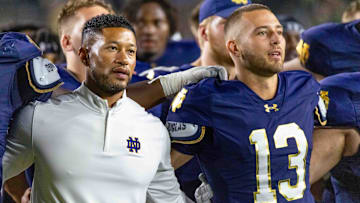 Sep 20, 2025; South Bend, Indiana, USA; Notre Dame Fighting Irish head coach Marcus Freeman and quarterback CJ Carr (13) sing the alma mater after beating the Purdue Boilermakers at Notre Dame Stadium. Mandatory Credit: Michael Caterina-Imagn Images
