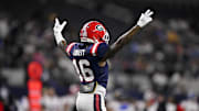 Dominic Lovett of Georgia (16) celebrates after the West miss a field goal to end the game at AT&T Stadium 