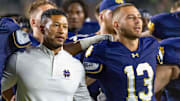 Sep 20, 2025; South Bend, Indiana, USA; Notre Dame Fighting Irish head coach Marcus Freeman and quarterback CJ Carr (13) sing the alma mater after beating the Purdue Boilermakers at Notre Dame Stadium. 