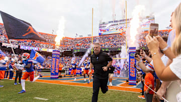 Florida Gators head coach Billy Napier runs onto the field before the start of the game at Ben Hill Griffin Stadium in Gainesville, FL on Saturday, September 7, 2024 against the Samford Bulldogs. The Gators won 45-7. [Doug Engle/Gainesville Sun]