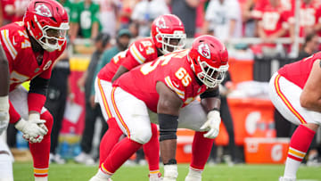 Sep 14, 2025; Kansas City, Missouri, USA; Kansas City Chiefs guard Trey Smith (65) at the line of scrimmage against the Philadelphia Eagles during the game at GEHA Field at Arrowhead Stadium. Mandatory Credit: Denny Medley-Imagn Images