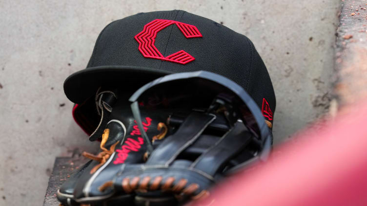 Cincinnati Reds hat and glove.