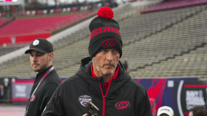 Feb 17, 2023; Raleigh, North Carolina, USA;  Carolina Hurricanes owner Tom Dundon looks on during practice at Carter-Finley Stadium. Mandatory Credit: James Guillory-Imagn Images
