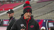Feb 17, 2023; Raleigh, North Carolina, USA;  Carolina Hurricanes owner Tom Dundon looks on during practice at Carter-Finley Stadium. Mandatory Credit: James Guillory-Imagn Images