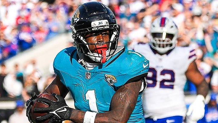 Jacksonville Jaguars running back Travis Etienne Jr. (1) runs towards the end zone during the fourth quarter in an NFL football AFC Wild Card playoff matchup, Sunday, Jan. 11, 2026, in Jacksonville, Fla. Bills lead 10-7 at the half over the Jaguars. The Bills defeated the Jaguars 27-24. [Doug Engle/Florida Times-Union]