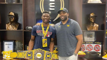 Four-star 2025 Marrero (La.) Archbishop Shaw running back Jasper Parker poses with Michigan head coach Sherrone Moore while on a visit to Ann Arbor.