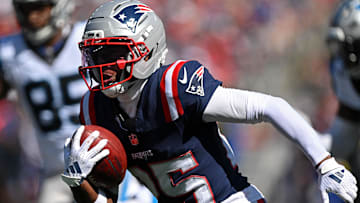 Sep 28, 2025; Foxborough, Massachusetts, USA; New England Patriots cornerback Marcus Jones (25) returns a punt for a touchdown against the Carolina Panthers during the first half at Gillette Stadium.