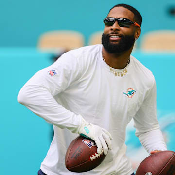 Aug 17, 2024; Miami Gardens, Florida, USA; Miami Dolphins wide receiver Odell Beckham, Jr. (3) throws the football before the preseason game against the Washington Commanders at Hard Rock Stadium.