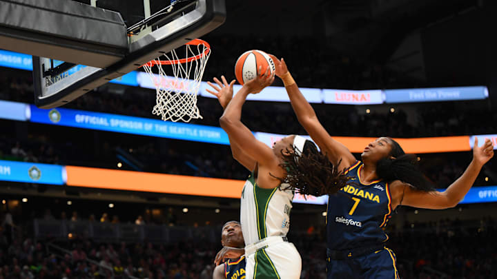 Aug 3, 2025; Seattle, Washington, USA; Indiana Fever forward Aliyah Boston (7) blocks a shot by Seattle Storm forward Nneka Ogwumike (3) during the second half at Climate Pledge Arena. 