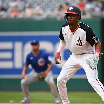 Darren Baker leads off first base after a hit in his first at-bat