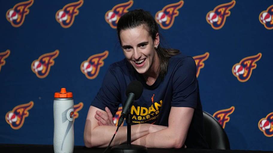 Indiana Fever guard Clark talks to media members pregame | Darren Yamashita-Imagn Images