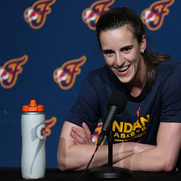 Indiana Fever guard Caitlin Clark (22) talks to media members before the game against the Golden State Valkyries.