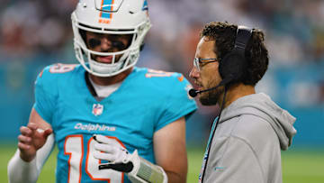 Aug 17, 2024; Miami Gardens, Florida, USA; Miami Dolphins head coach Mike McDaniel talks to quarterback Skylar Thompson (19) on the sideline against the Washington Commanders during the second quarter at Hard Rock Stadium.