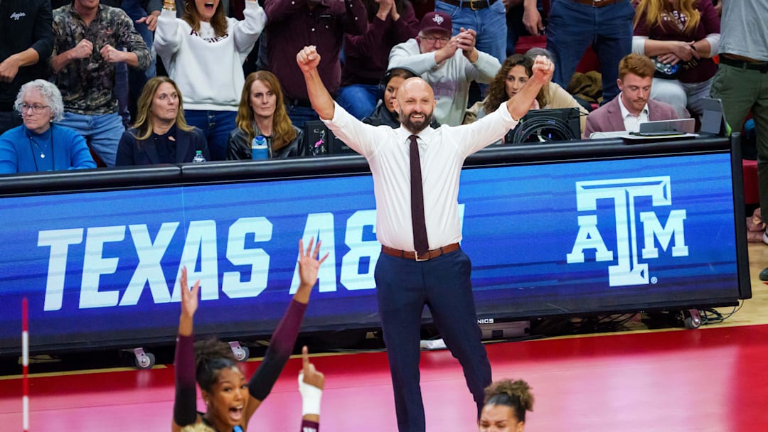 Dec 14, 2025; Lincoln, NE, USA; Texas A&M Aggies head coach Jamie Morrison reacts after a point against the Nebraska Cornhuskers during the first set at Bob Devaney Sports Center. Mandatory Credit: Dylan Widger-Imagn Images