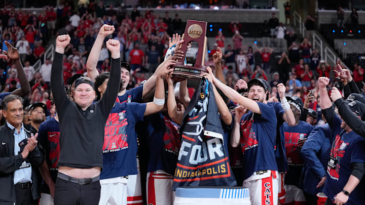 Mar 28, 2026; San Jose, CA, USA; The Arizona Wildcats celebrate with the West Regional Championship trophy after an Elite Eight game against the Purdue Boilermakers of the West Regional of the men's 2026 NCAA Tournament at SAP Center. Mandatory Credit: Kyle Terada-Imagn Images