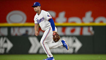 Apr 5, 2024; Arlington, Texas, USA; Texas Rangers second base Justin Foscue (56) makes his major league debut during the eighth inning against the Houston Astros at Globe Life Field. Mandatory Credit: Jerome Miron-USA TODAY Sports