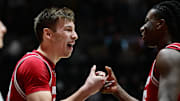 Feb 15, 2025; West Lafayette, Indiana, USA; Wisconsin Badgers guard Jack Janicki (33) celebrates with guard John Blackwell (25) after defeating the Purdue Boilermakers at Mackey Arena. Mandatory Credit: Marc Lebryk-Imagn Images