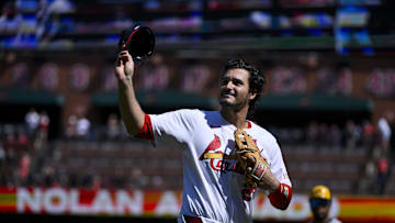 Sep 21, 2025; St. Louis, Missouri, USA; St. Louis Cardinals third baseman Nolan Arenado (28) salutes the fans after he was ceremonially removed before the start of the first inning against the Milwaukee Brewers at Busch Stadium. Mandatory Credit: Jeff Curry-Imagn Images