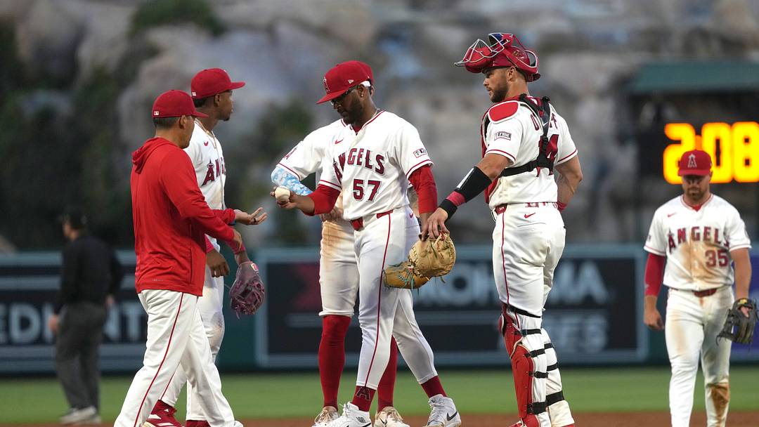 Jun 26, 2026; Anaheim, California, USA; Los Angeles Angels pitcher Walbert Ureña (57) is removed by manager Kurt Suzuki in the fifth inning as catcher Logan O'Hoppe (14) watches against the Athletics at Angel Stadium. Mandatory Credit: Kirby Lee-Imagn Images