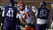 Nov 30, 2024; Chicago, Illinois, USA;  Illinois Fighting Illini running back Aidan Laughery (21) celebrates after scoring a touchdown against the Northwestern Wildcats during the second half at Wrigley Field. Mandatory Credit: Matt Marton-Imagn Images