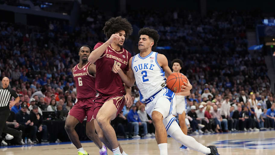Cam Boozer drives to the hoop