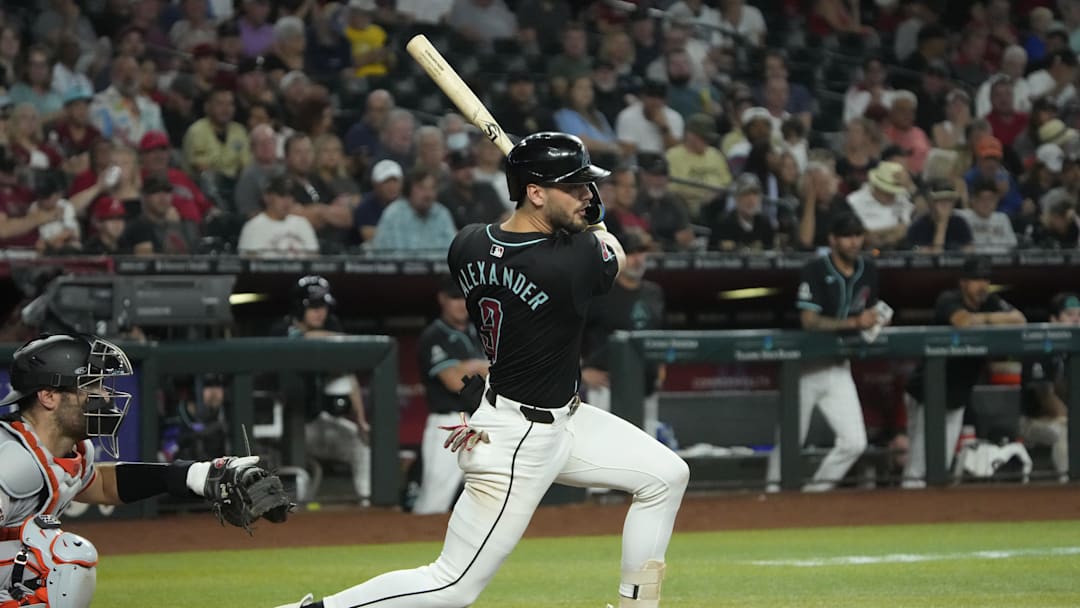 Jun 5, 2024; Phoenix, Arizona, USA; Arizona Diamondbacks shortstop Blaze Alexander (9) hits a single against the San Francisco Giants in the fourth inning at Chase Field. Mandatory Credit: Rick Scuteri-Imagn Images