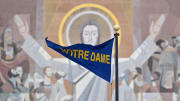 Nov 19, 2022; South Bend, Indiana, USA; A Notre Dame pennant flies in front of the Word of Life Mural, commonly known as Touchdown Jesus, before the game between the Notre Dame Fighting Irish and the Boston College Eagles at Notre Dame Stadium. 