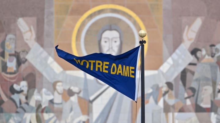 Nov 19, 2022; South Bend, Indiana, USA; A Notre Dame pennant flies in front of the Word of Life Mural, commonly known as Touchdown Jesus, before the game between the Notre Dame Fighting Irish and the Boston College Eagles at Notre Dame Stadium.