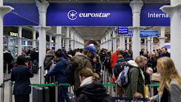 European train travelers queue up