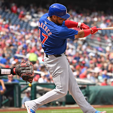 Sep 1, 2024; Washington, District of Columbia, USA; Chicago Cubs third baseman Isaac Paredes (17) hits the ball into play against the Washington Nationals during the second inning at Nationals Park.