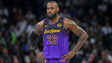 Dec 2, 2024; Minneapolis, Minnesota, USA; Los Angeles Lakers forward LeBron James (23) against the Minnesota Timberwolves in the first quarter at Target Center. Mandatory Credit: Brad Rempel-Imagn Images