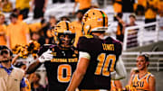 Aug 30, 2025; Tempe, Arizona, USA;  Arizona State Sun Devils wide receiver Jordyn Tyson (0) and  Arizona State Sun Devils quarterback Sam Leavitt (10) celebrates a touchdown in the fourth quarter between Arizona State Sun Devils and Northern Arizona Lumberjacks at Mountain America Stadium. Mandatory Credit: Arianna Grainey-Imagn Images