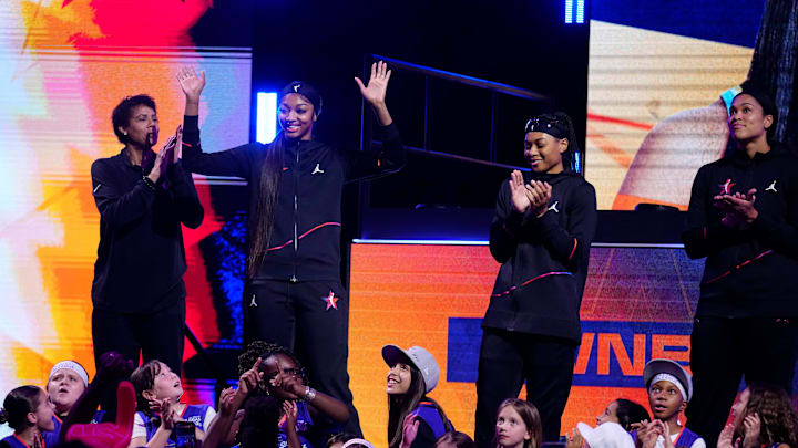 Team WNBA forward Angel Reese waves to fans during the WNBA All-Star Game at Footprint Center in Phoenix on July 20, 2024.