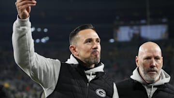 Dec 23, 2024; Green Bay, Wisconsin, USA;  Green Bay Packers head coach Matt LaFleur celebrates while walking off the field following the game against the New Orleans Saints at Lambeau Field. Mandatory Credit: Jeff Hanisch-Imagn Images