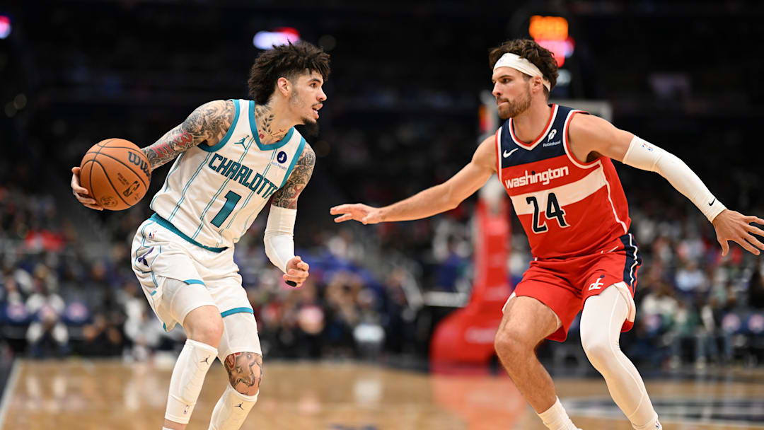 Oct 26, 2025; Washington, District of Columbia, USA; Charlotte Hornets guard LaMelo Ball (1) attempts to drive past Washington Wizards forward Corey Kispert (24) during the third quarter at Capital One Arena. Mandatory Credit: Rafael Suanes-Imagn Images Oct 26, 2025; Washington, District of Columbia, USA; Charlotte Hornets guard LaMelo Ball (1) attempts to drive past Washington Wizards forward Corey Kispert (24) during the third quarter at Capital One Arena. Mandatory Credit: Rafael Suanes-Imagn Images