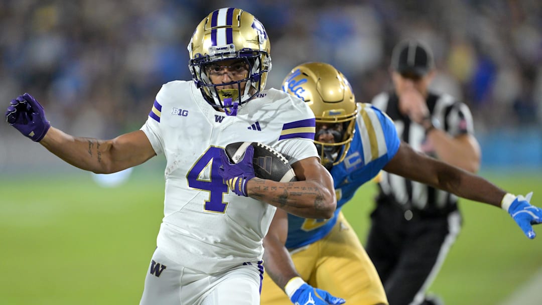 Nov 22, 2025; Pasadena, California, USA;  Washington Huskies wide receiver Omari Evans (5) is forced out of bounds after a 9-yard gain during the first half against the UCLA Bruins at the Rose Bowl. Mandatory Credit: Jayne Kamin-Oncea-Imagn Images