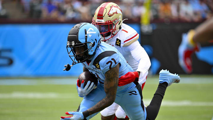 Mar 30, 2024; Arlington, TX, USA; Arlington Renegades wide receiver Deontay Burnett (21) catches a pass in front of Birmingham Stallions defensive back Chris Jackson (1) during the first half at Choctaw Stadium. Mandatory Credit: Jerome Miron-USA TODAY Sports