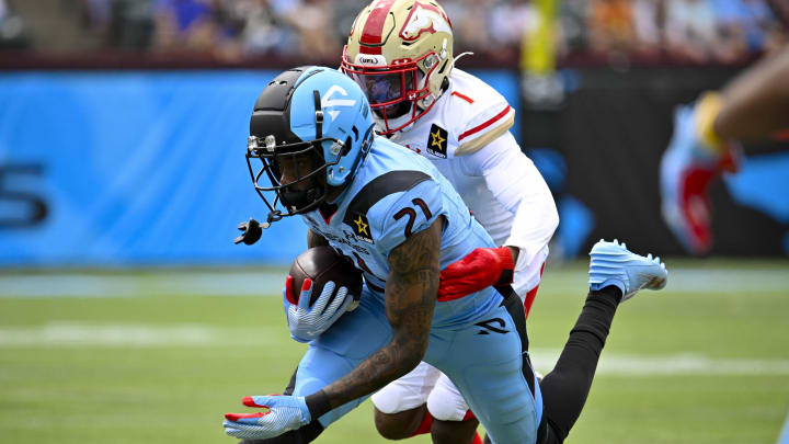 Mar 30, 2024; Arlington, TX, USA; Arlington Renegades wide receiver Deontay Burnett (21) catches a pass in front of Birmingham Stallions defensive back Chris Jackson (1) during the first half at Choctaw Stadium. 